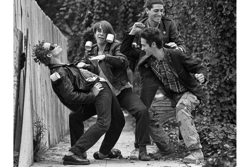 The Red Hot Chili Peppers, from left, are Flea, Anthony Kiedis, Jack Sherman and Cliff Martinez. This photo appeared in the Feb. 12, 1984, Los Angeles Times. This image is from the Los Angeles Times Archive at UCLA.