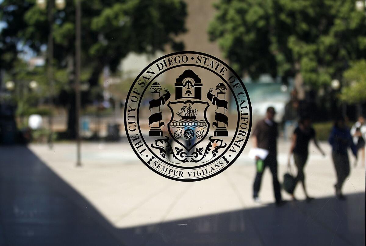A seal of the city of San Diego on a window in City Hall. 