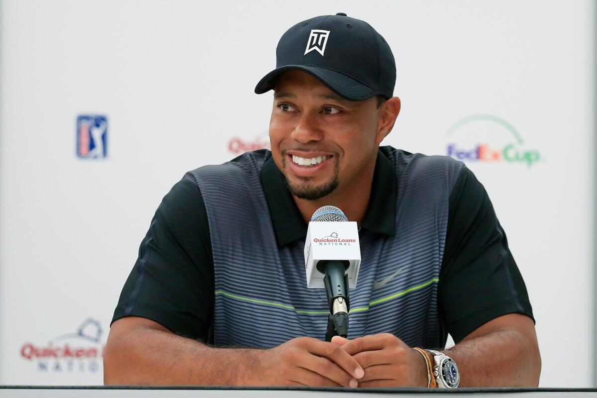 Tiger Woods talks to the media Tuesday at Congressional Country Club in Bethesda, Md., where he'll make his return from back surgery in this week's Quicken Loans National.