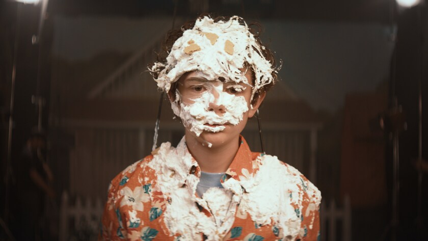 Noah Jupe, in the movie "Honey Boy," appears to have just taken a pie to the face.