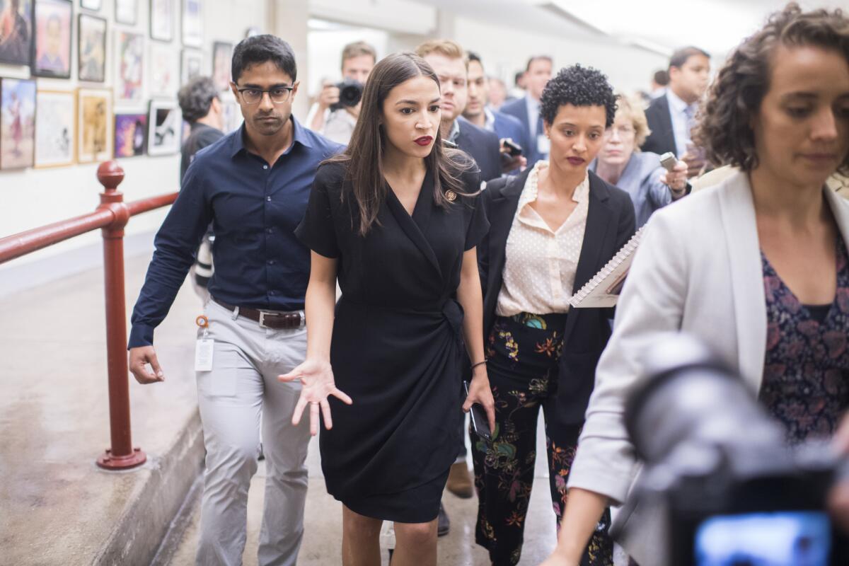 Rep. Alexandria Ocasio-Cortez leaves a news conference at the Capitol in 2019.