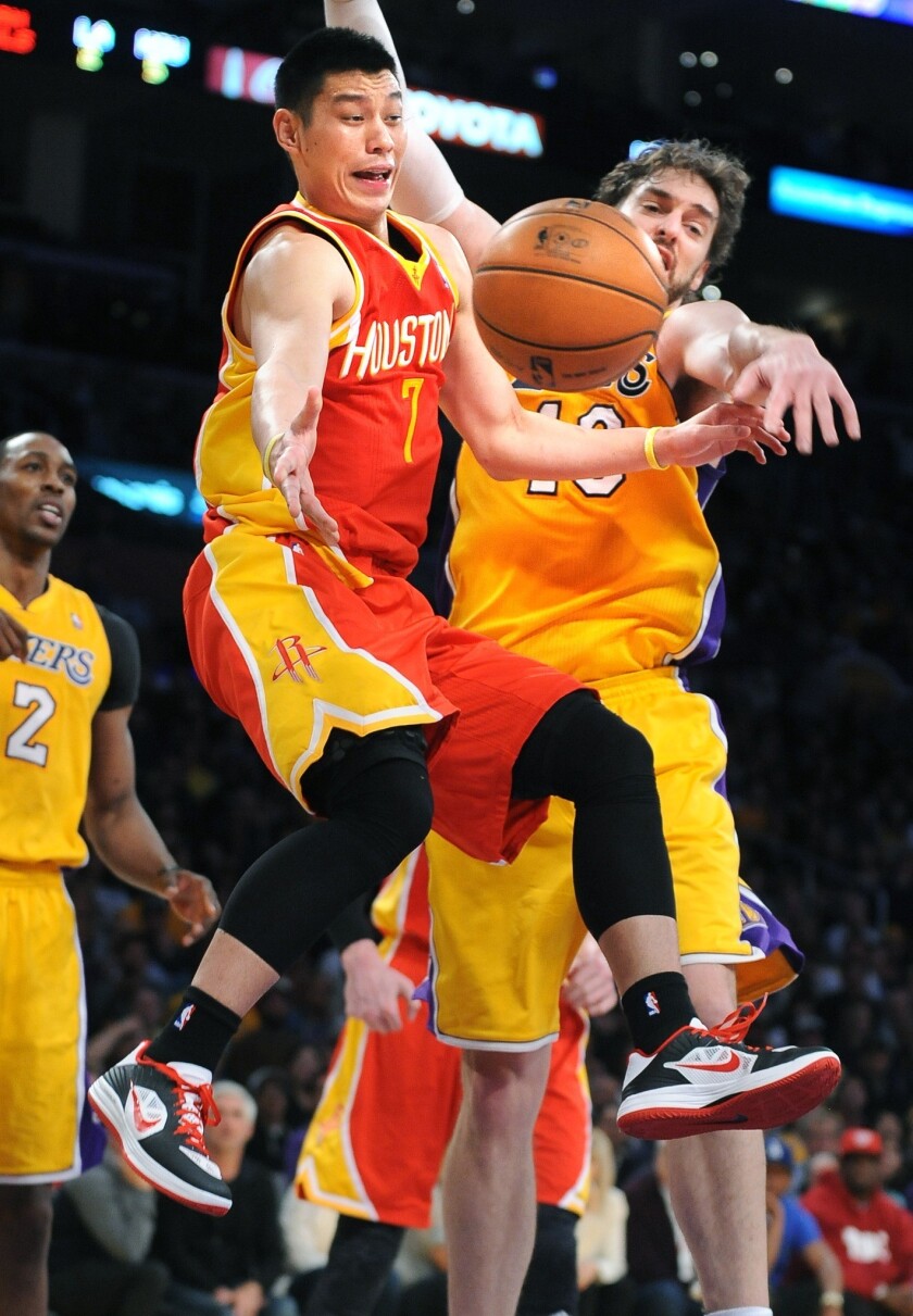 Lakers power forward Pau Gasol forces Rockets point guard Jeremy Lin to pass after a drive in the second half Wednesday night.