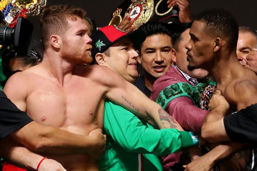 LAS VEGAS, NEVADA - MAY 03: Canelo Alvarez and Daniel Jacobs get into a shoving match during their official weigh in at T-Mobile Arena on May 3, 2019 in Las Vegas, Nevada. Alvarez and Jacobs will fight to unify the WBC WBA and IBF Titles on May 04, 2019 at T-Mobile Arena. (Photo by Al Bello/Getty Images) ** OUTS - ELSENT, FPG, CM - OUTS * NM, PH, VA if sourced by CT, LA or MoD **