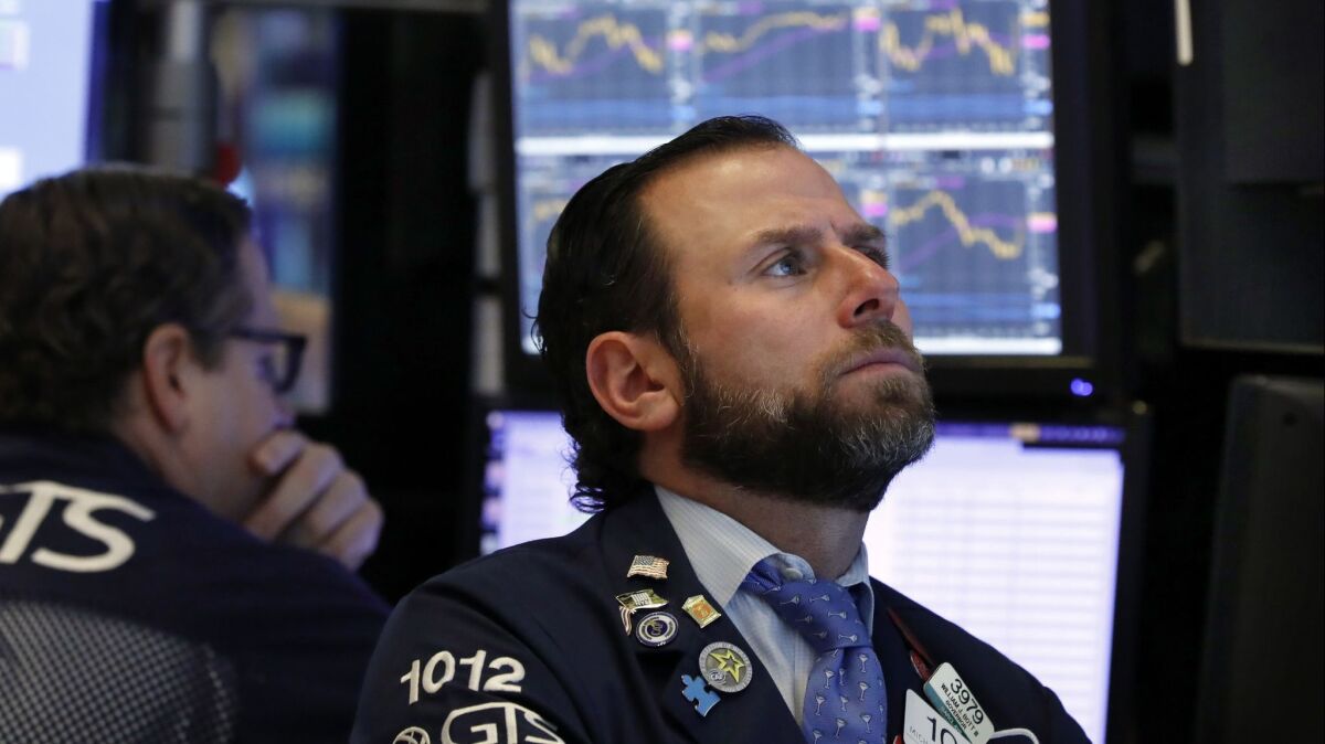 Specialist Michael Pistillo on the floor of the New York Stock Exchange in early January.