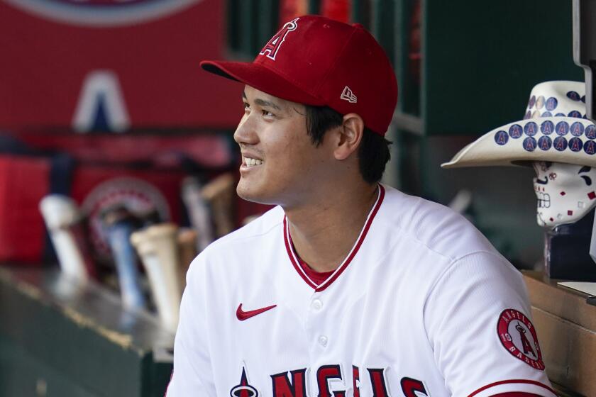 Los Angeles Angels designated hitter Shohei Ohtani (17) sits in the dugout.