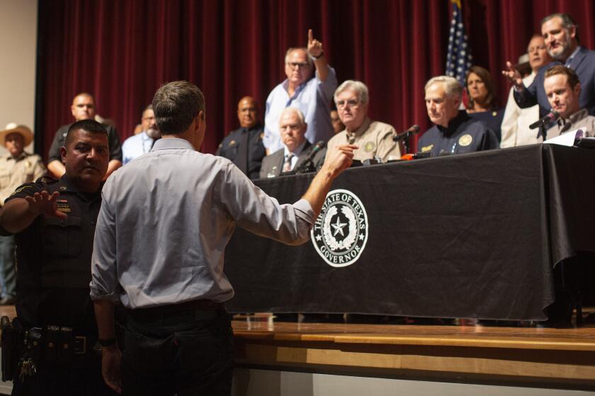 Democrat Beto O’Rourke, who is running against Abbott for governor this year, interrupts a news conference headed by Texas Gov. Greg Abbott in Uvalde, Texas Wednesday, May 25, 2022. (AP Photo/Dario Lopez-Mills)