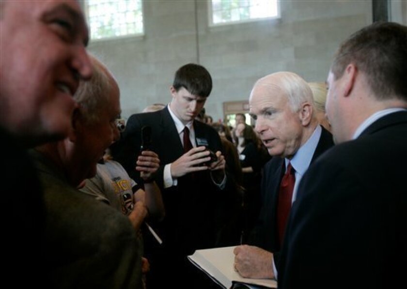 In this May 6, 2008 file photo, Republican presidential candidate Sen. John McCain, R-Ariz., second from right, signs autographs after campaigning at Wake Forest University in Winston-Salem, N.C. All of a sudden, North Carolina matters. It hasn't for decades in presidential elections. Then Democrat Barack Obama made an aggressive play for this traditionally GOP state and polls showed the race tightening. That forced Republican John McCain to defend his turf or risk ceding the southern state _ and its 15 electoral votes _ to Democrats for the first time in 32 years. (AP Photo/Jeff Chiu, File)