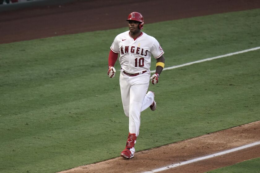 Los Angeles Angels' Justin Upton runs toward home after hitting a two-run home run against the Houston Astros during the fifth inning of the first baseball game of a doubleheader, Saturday, Sept. 5, 2020, in Anaheim, Calif. (AP Photo/Jae C. Hong)