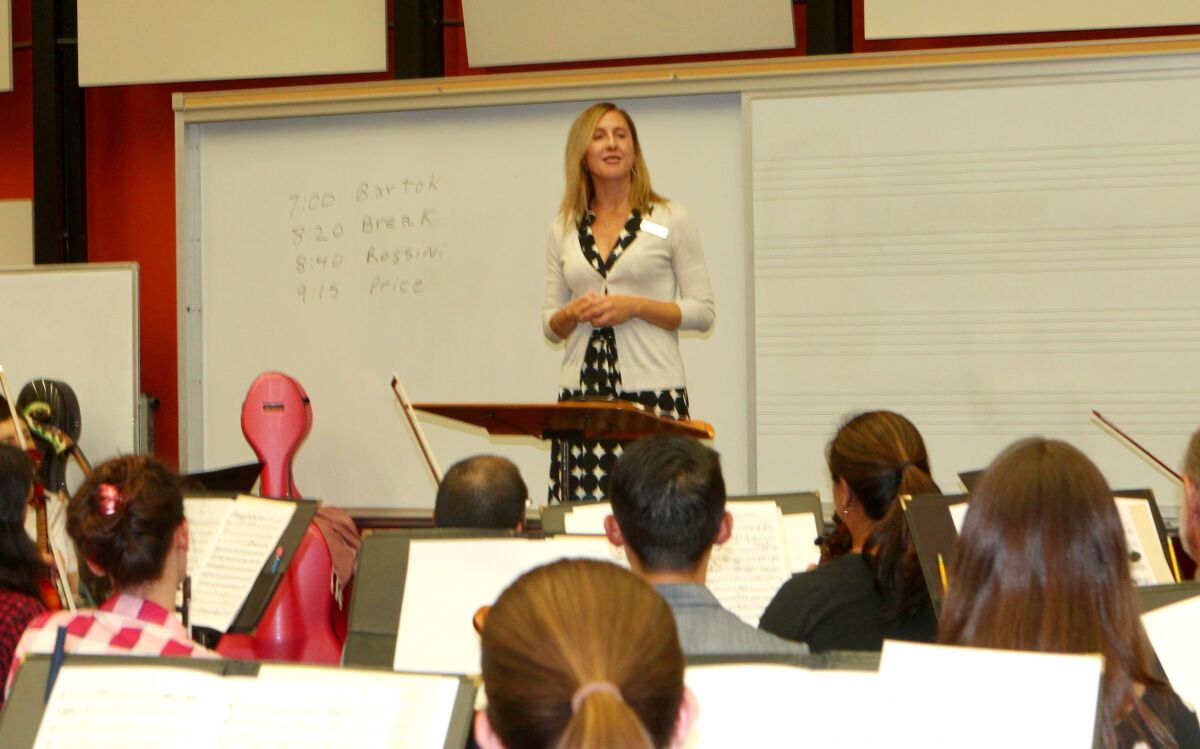 Weaver introduces herself to about 75 of 90 symphony musicians during the first practice of the season on Oct. 7.