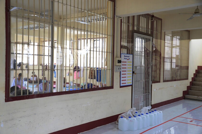 In this photo released by Department of Corrections, COVID-19 prisoners sit inside a field hospital set up at Medical Correctional Institution to treat COVID-19 inmates, in Bangkok, Thailand, on May 8, 2021. Almost 3,000 inmates incarcerated at two prisons in Thailand’s capital Bangkok have tested positive for COVID-19, the Corrections Department said Wednesday, May 12, 2021 as the Southeast Asian nation battles a virulent third wave of the coronavirus. (Department of Corrections, Thailand via AP)