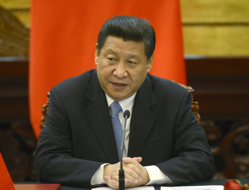 Chinese President Xi Jinping speaks during a news conference at the Great Hall of the People in Beijing.