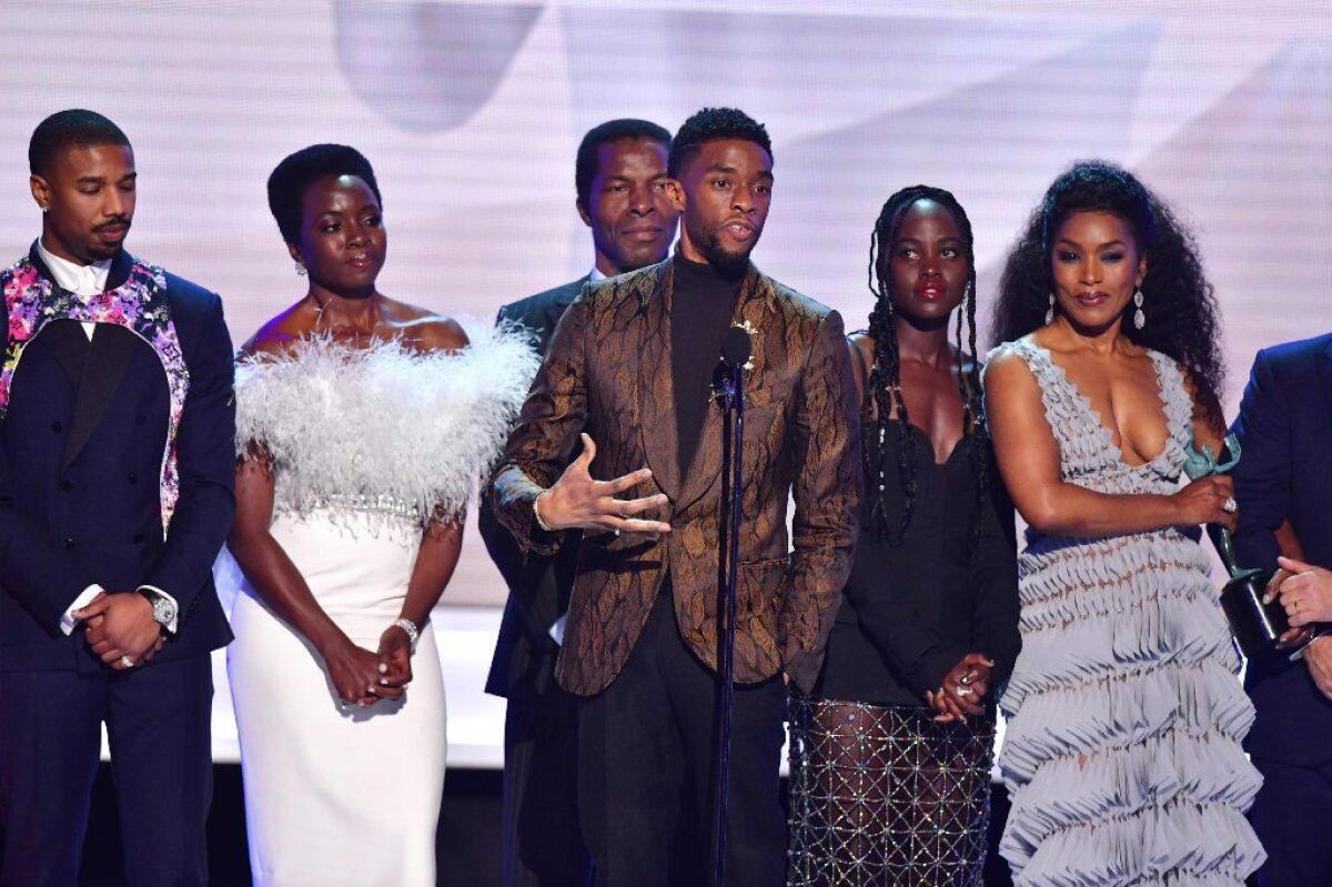 Chadwick Boseman, center, Michael B. Jordan, far left, Danai Gurira, Lupita Nyong'o, Angela Bassett and the cast of "Black Panther" accept the award for ensemble cast in a motion picture at the 25th annual Screen Actors Guild Awards.