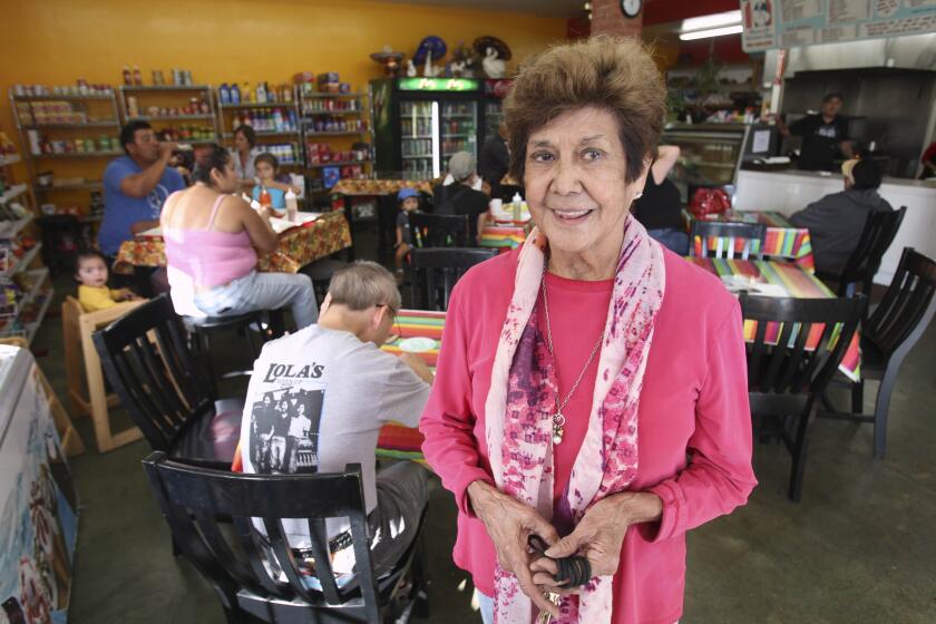 CARLSBAD, CA, NOVEMBER 24, 2015 |Ofie Escobedo stands in Lola's Market, a family owned business since the 1940's, in Carlsbad on Tuesday. | -Mandatory Photo Credit: Photo by Hayne Palmour IV/San Diego Union-Tribune, LLC