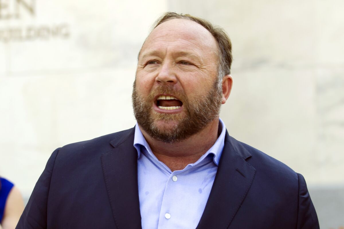 FILE - Infowars host Alex Jones speaks outside of the Dirksen building on Capitol Hill, Sept. 5, 2018, in Washington. Jones was defiant and cited free speech rights during a deposition in April, as part of a lawsuit by relatives of some of the Sandy Hook Elementary School shooting victims who are suing him for calling the massacre a hoax, according to court documents released Thursday, July 14, 2022. (AP Photo/Jose Luis Magana, File)