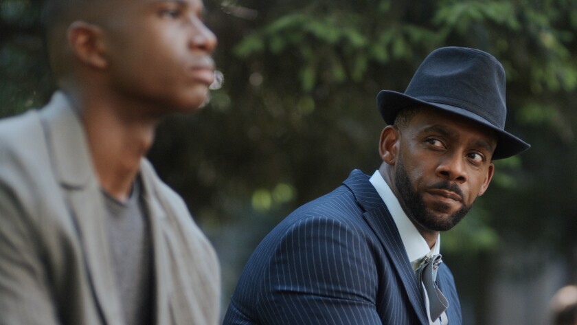 Martin Bobb-Semple, left, and Richard Blackwood in a new episode of "Pandora" on CW.