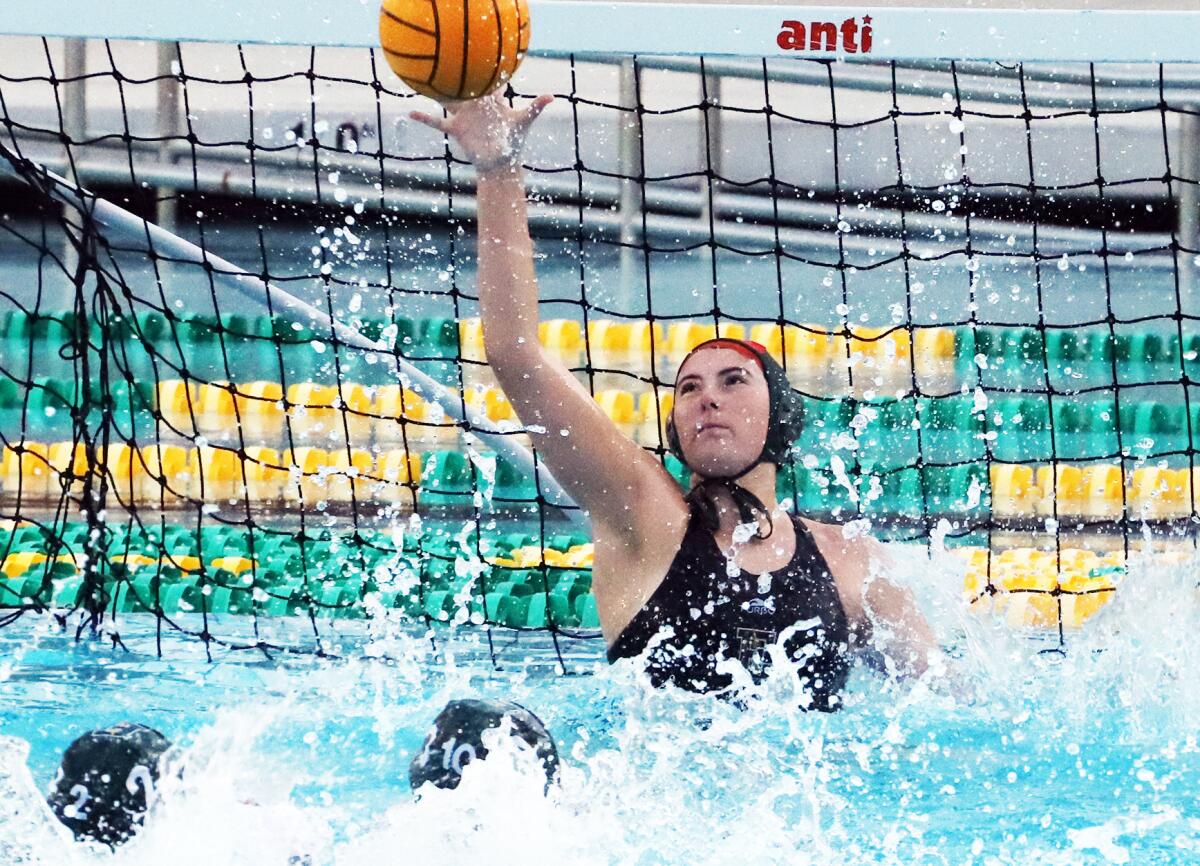 Edison goalie Skyler Spencer (1) makes one of her 17 saves against Woodbridge.