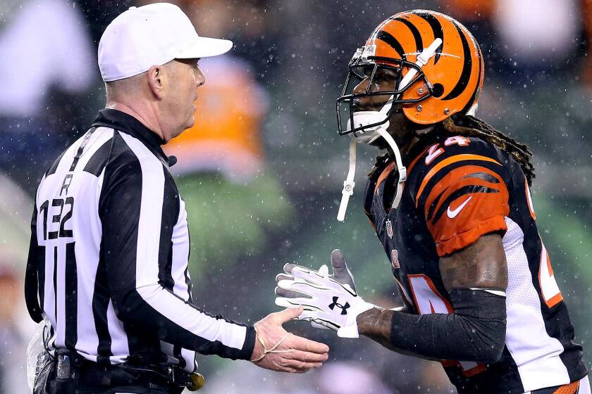 Bengals cornerback Adam "Pacman" Jones argues a call with referee John Parry during the fourth quarter of a playoff game against the Steelers.