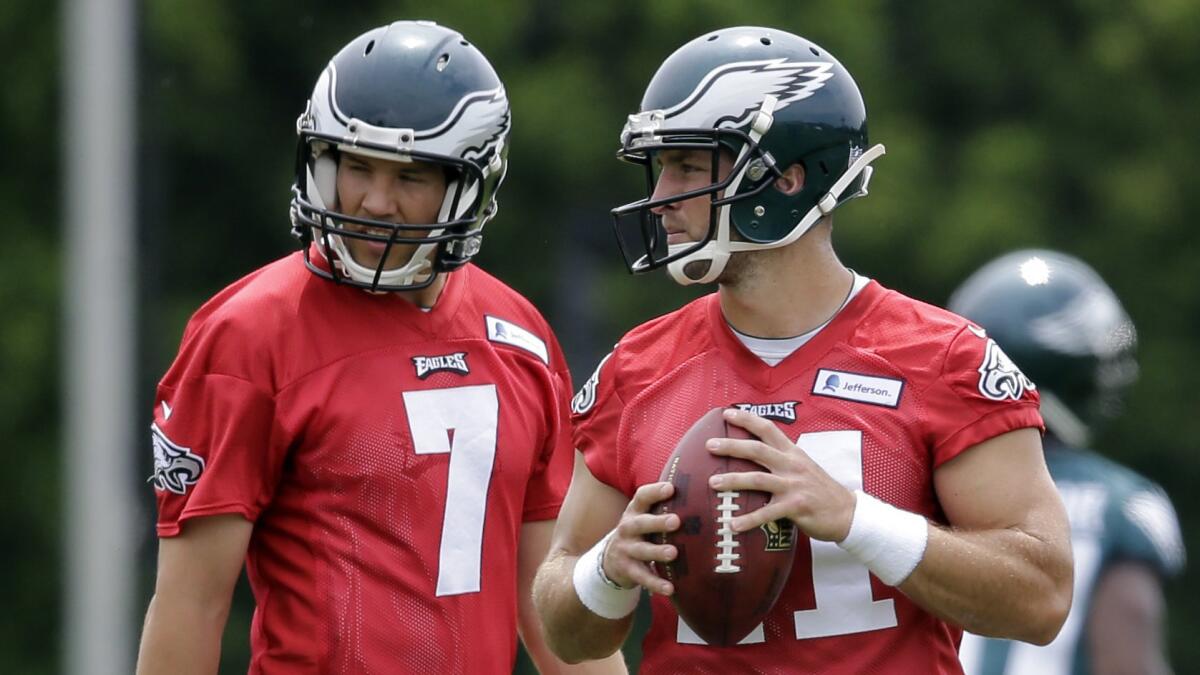 Philadelphia Eagles quarterbacks Sam Bradford, left, and Tim Tebow take part in a minicamp session in Philadelphia on June 16.