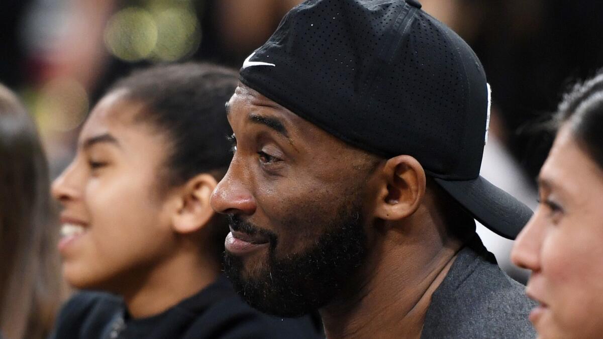 Lakers legend Kobe Bryant and his daughter, Gianna, attend the Sparks' season opener against the Las Vegas Aces on Sunday. Bryant is a big WNBA fan.