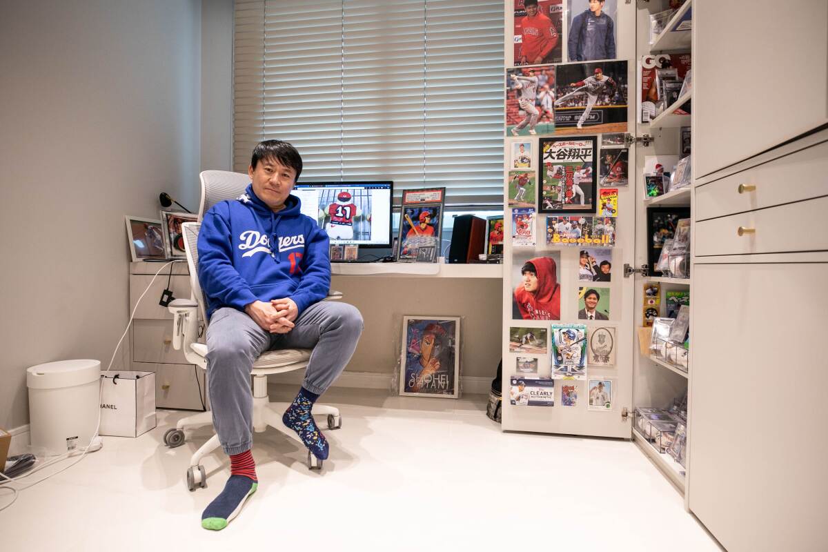 Lee Jae-ik sits among Shohei Ohtani memorabilia.