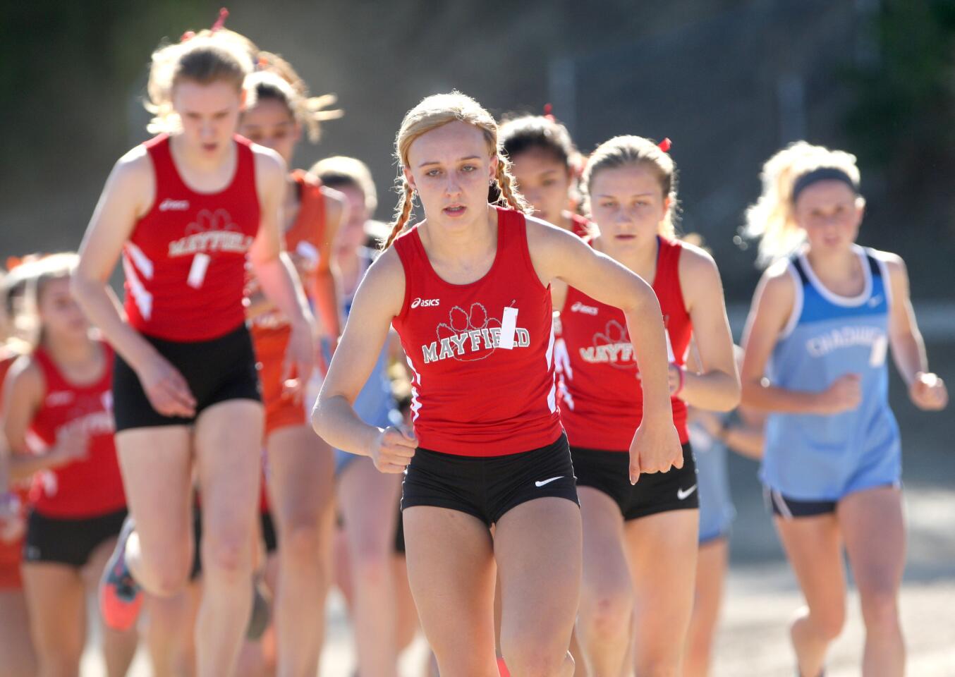 Mayfield High School girls' varsity cross country runner Emily Serhan ran her way to first place in the Prep League Cross Country Finals at Pierce College in Woodland Hills on Saturday, Oct. 31, 2015.