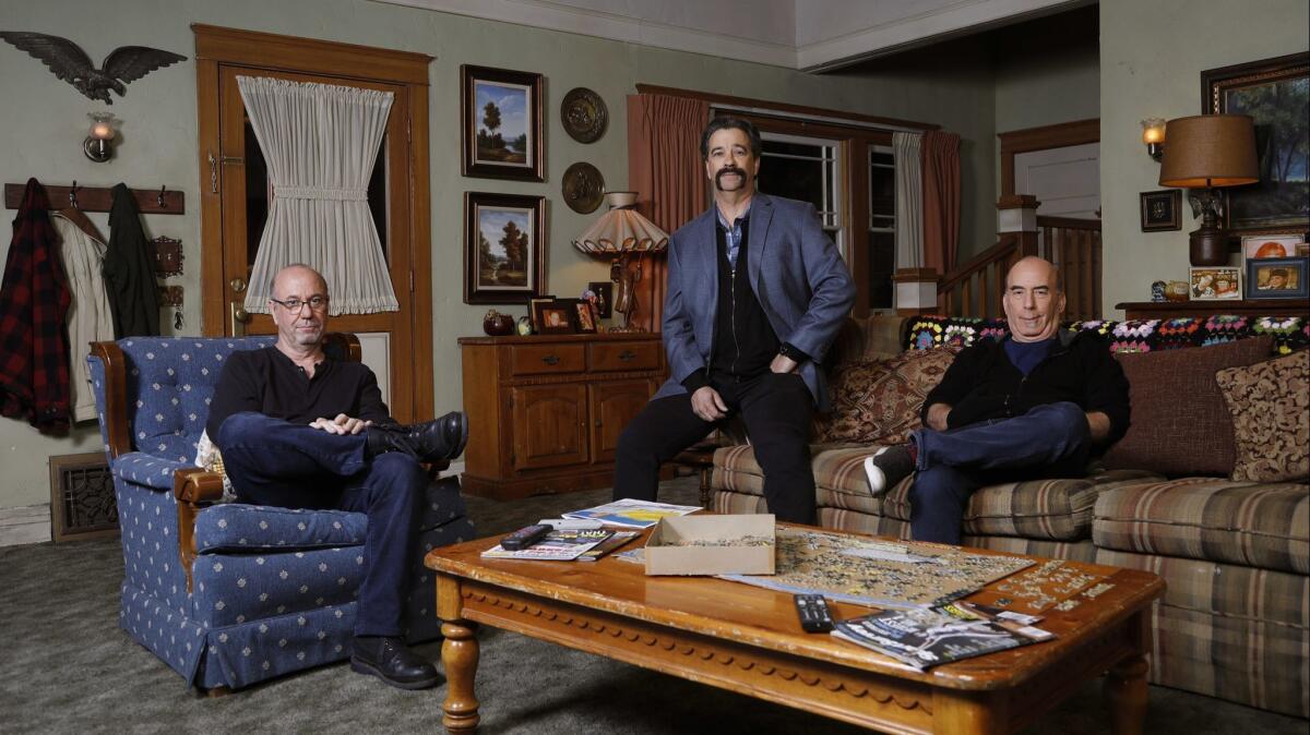 "The Conners" executive producers Bruce Rasmussen, left, Dave Caplan, center, and Bruce Helford, are photographed on the set.