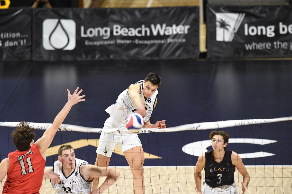 Long Beach State's Alex Nikolov spikes the ball during a match against Ohio State.