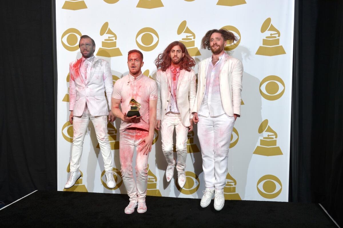 Ben McKee, Dan Reynolds, Wayne Sermon and Daniel Platzman of Imagine Dragons pose backstage at the Grammy Awards presentation.
