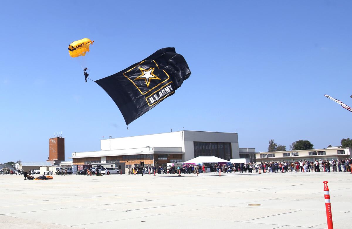 A member of the U.S. Army Golden Knights parachute team lands in Los Alamitos on Thursday,