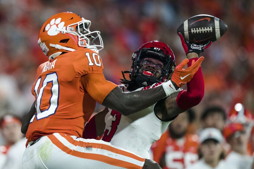 North Carolina State cornerback Aydan White (3) knocks the ball away from Clemson wide receiver Joseph Ngata (10) in the first half of an NCAA college football game, Saturday, Oct. 1, 2022, in Clemson, S.C. (AP Photo/Jacob Kupferman)