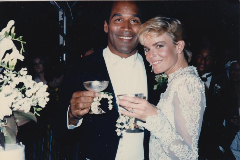 An image from "O.J.: Made In America" of O.J. Simpson, with bride Nicole Brown Simpson.