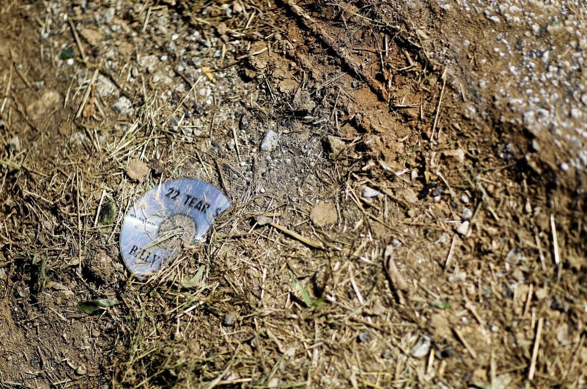 A CD is among debris at the scene of an accident that killed rapper Shawty Lo in Atlanta on Wednesday.