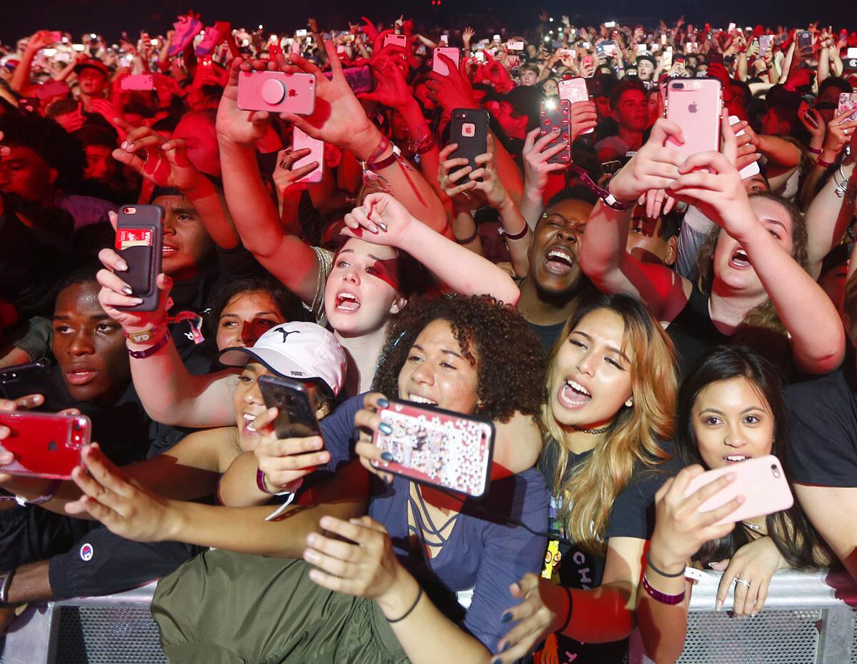 Fans take photos as Chance the Rapper performs at the Valley View Casino Center in San Diego on Monday, April 24, 2017. (Photo by K.C. Alfred/The San Diego Union-Tribune)