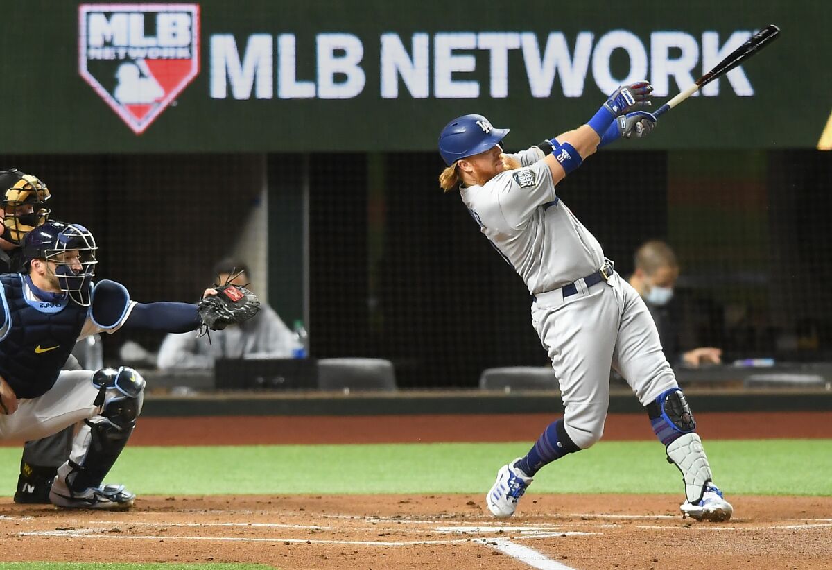 The Dodgers' Justin Turner hits a first-inning solo home run in Game 3 of the World Series.