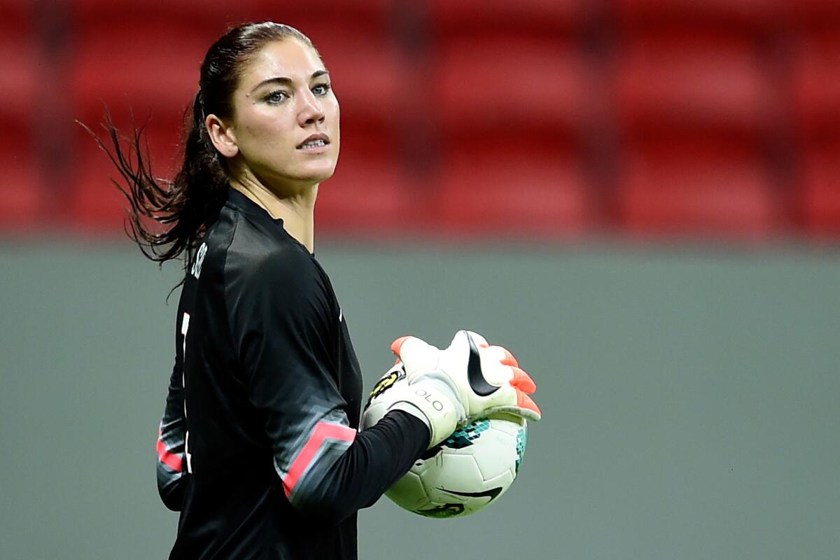 U.S. national team goalkeeper Hope Solo holds the ball during a match against China on Dec. 10 in Brazil.