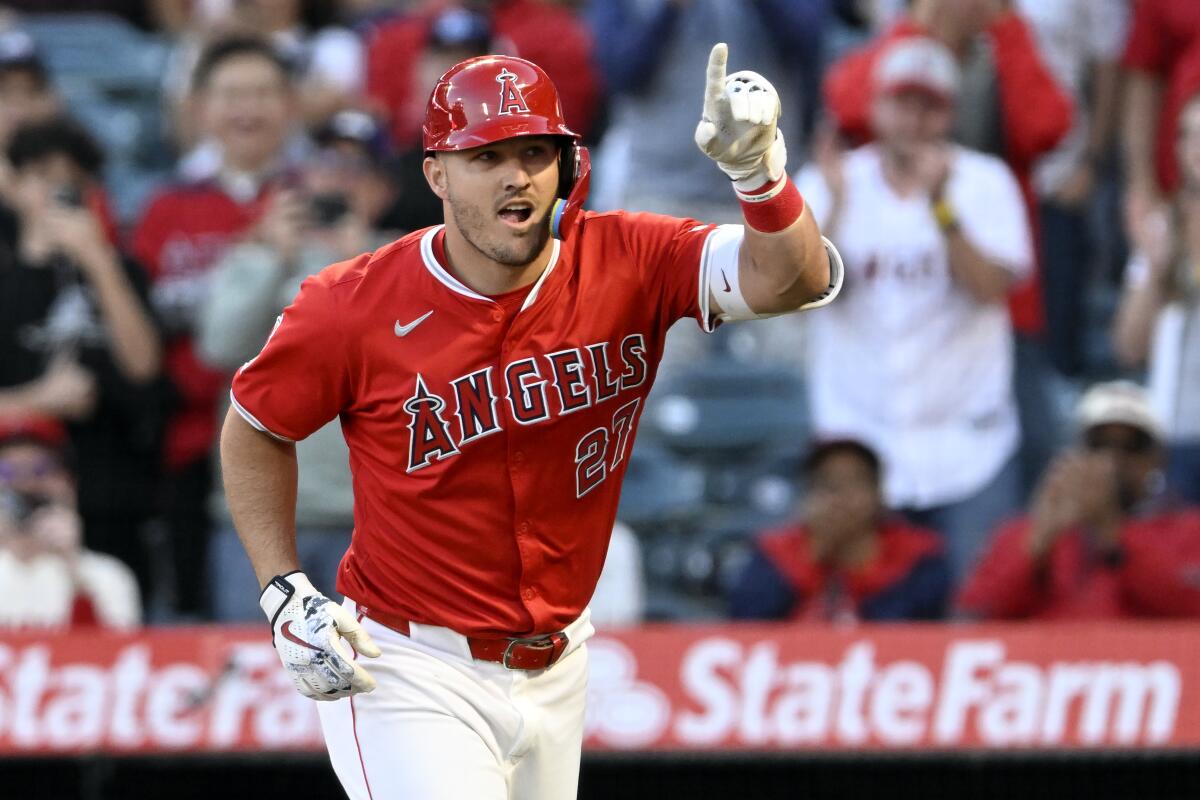 Mike Trout gestures after his home run in the first inning.