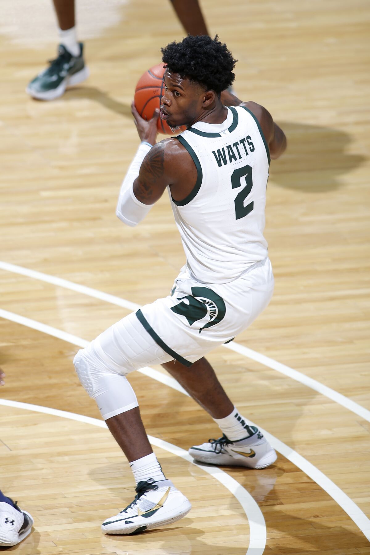 Michigan State's Rocket Watts controls the ball during a game against Notre Dame.