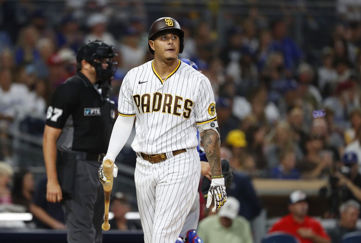 San Diego's Manny Machado walks off after striking out against the Dodgers on Thursday.