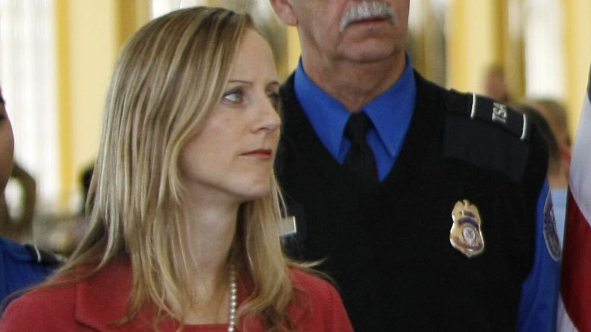 Kathy Kraninger, President Trump's nominee to head the Consumer Financial Protection Bureau, is shown at a 2008 news conference when she was a deputy assistant secretary at the Department of Homeland Security.