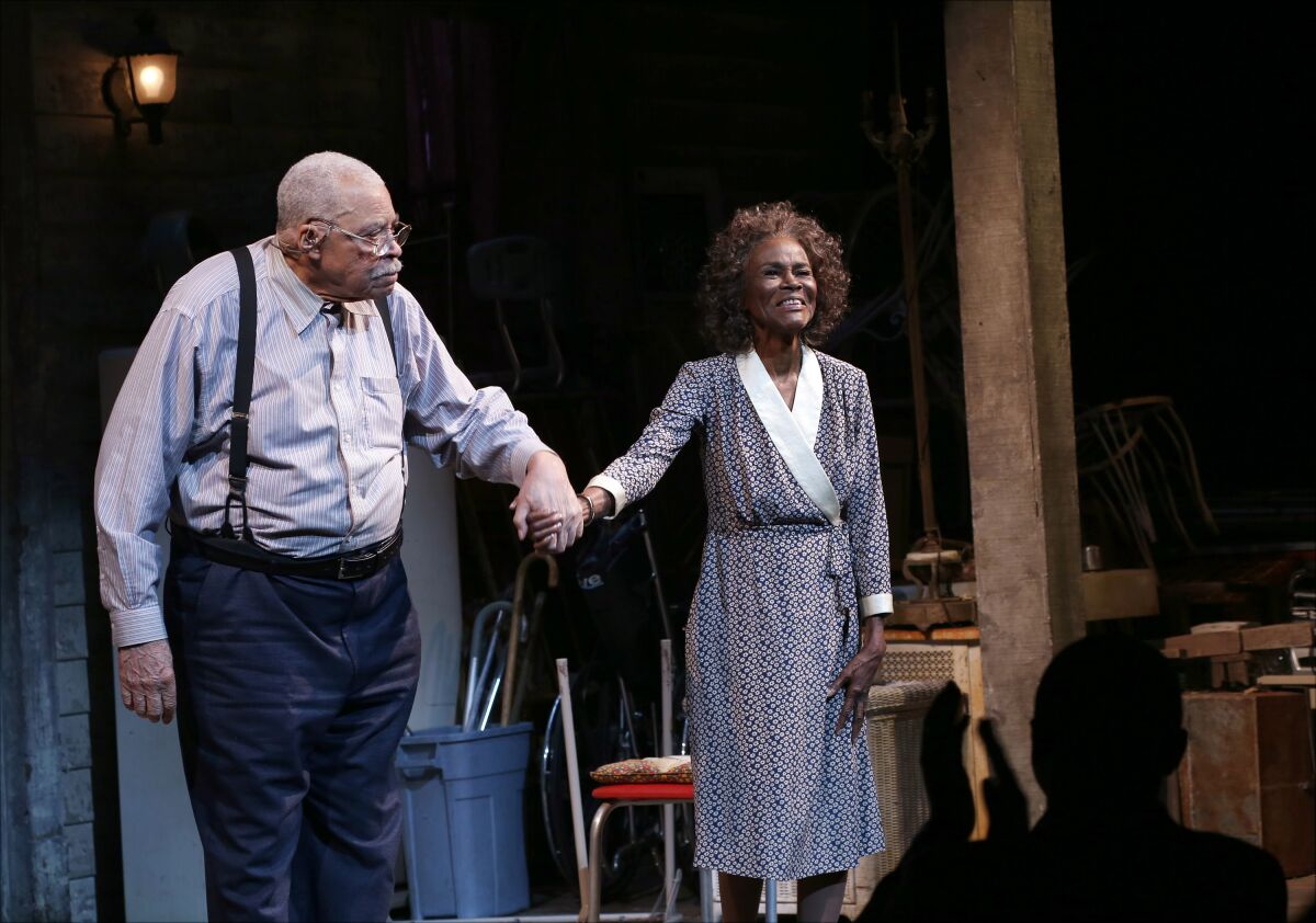 James Earl Jones and Cicely Tyson holding hands onstage