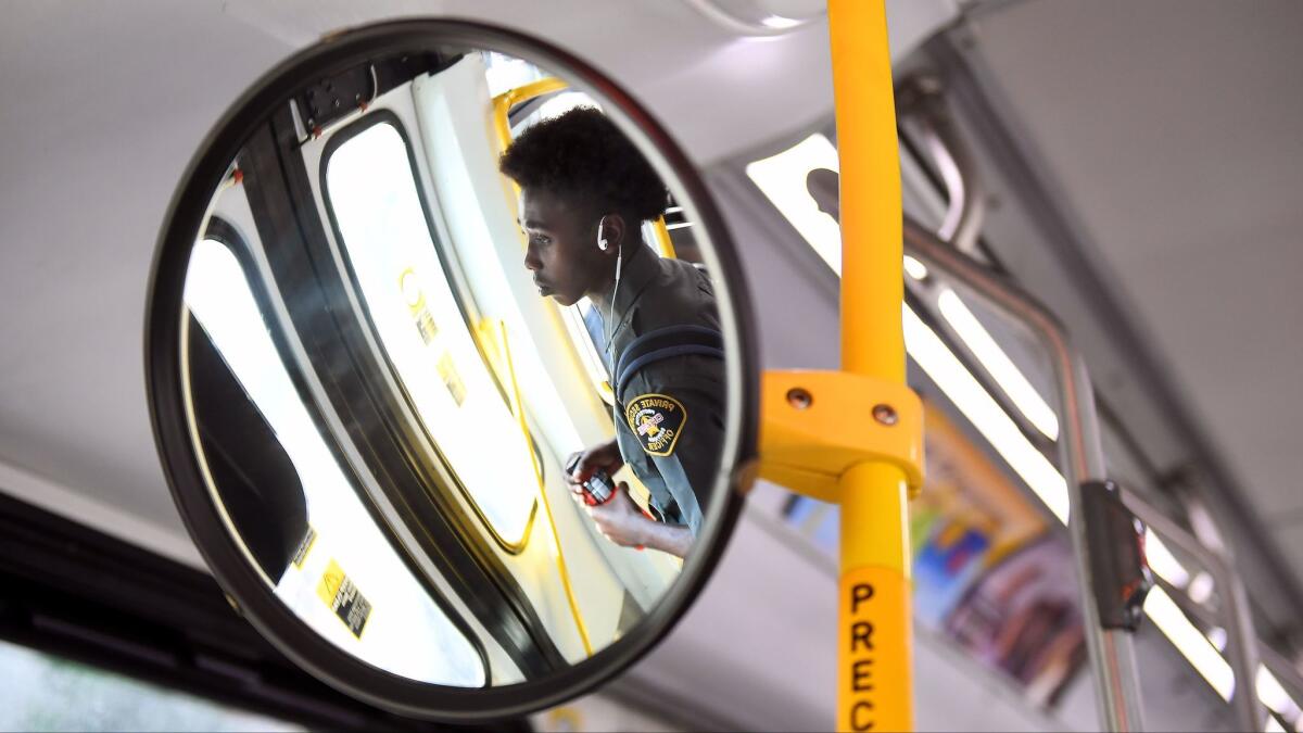 Usher rides the bus to work in downtown Los Angeles.