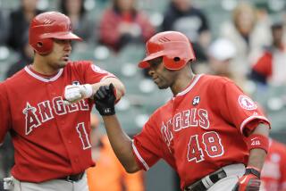 Angels' Torri Hunter is congratulated by Kendry Morales after hitting a home run against the Orioles on April 29, 2009.