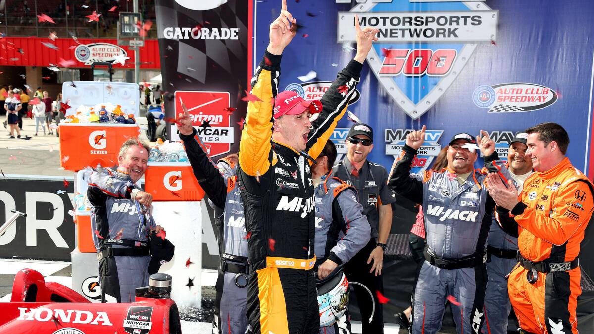 IndyCar driver Graham Rahal celebrates Saturday after winning the MAVTV 500 race at Auto Club Speedway in Fontana, Calif.