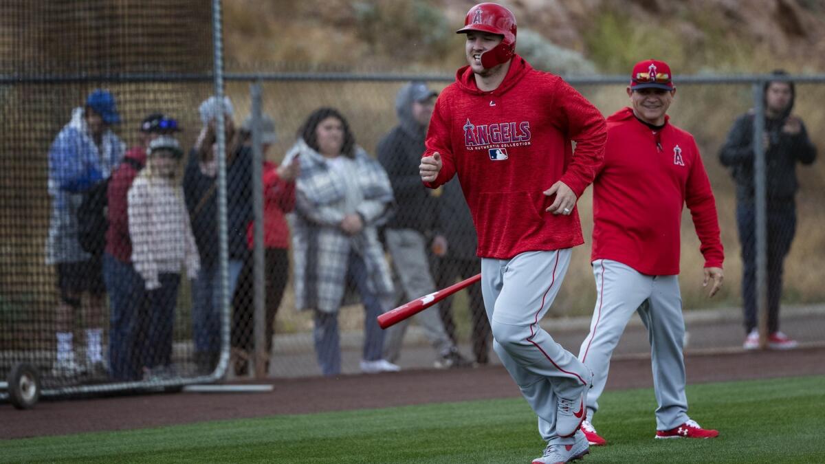 Angels outfielder Mike Trout participates in baserunning drills during spring training at Tempe Diablo Stadium on Monday.