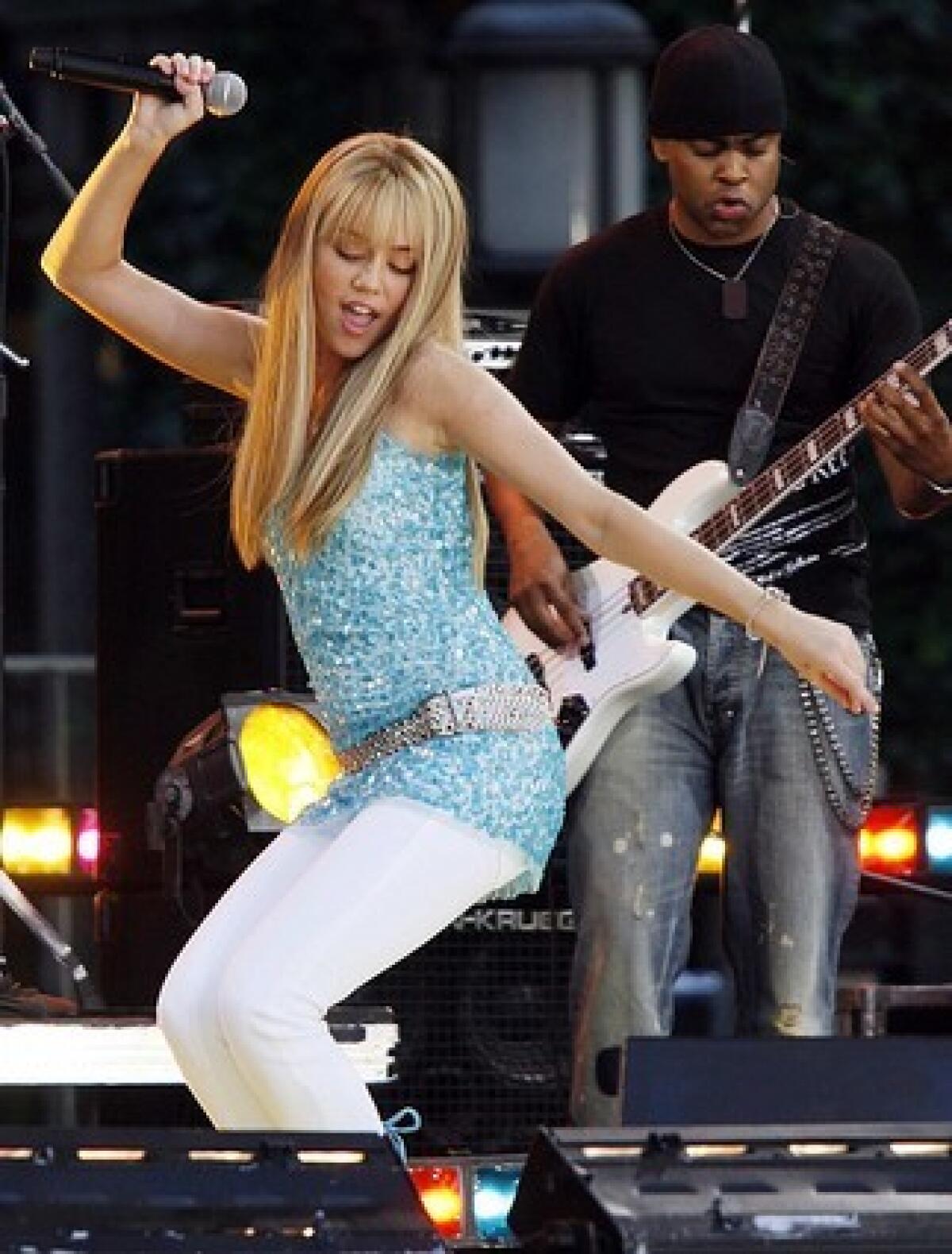 Miley Cyrus (pictured at a past performance) happily improvised when her mic went out during a concert at Hollywood and Highland.