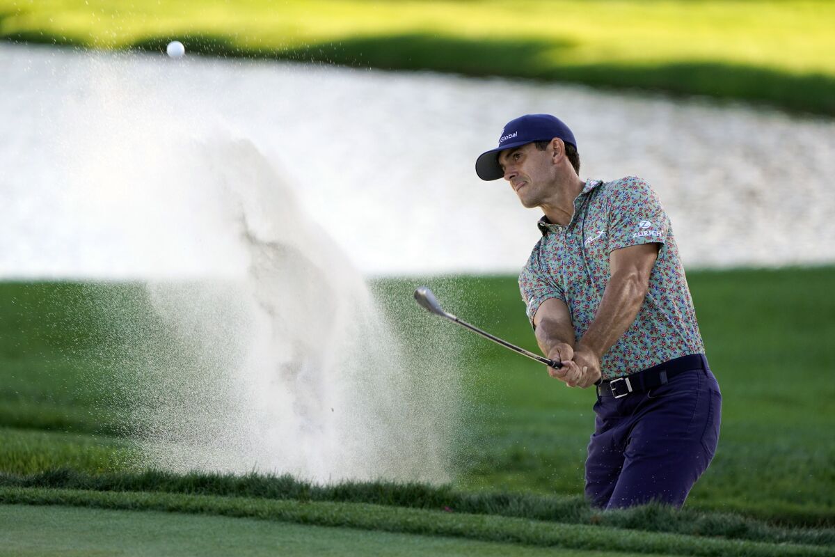 Billy Horschel hits a shot from a sand trap to the 17th green during the third round of the Arnold Palmer Invitational golf tournament, Saturday, March 5, 2022, in Orlando, Fla. (AP Photo/John Raoux)