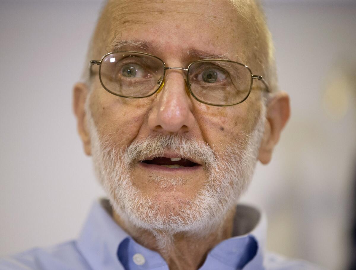 FILE - In this Dec. 17, 2014 file photo, Alan Gross speaking during a news conference at his lawyer's office in Washington. Gross, who returned home last month after spending five years imprisoned in Cuba, will have a prime viewing spot for President Barack Obama's State of the Union address: a seat near first lady Michelle Obama. (AP Photo/Pablo Martinez Monsivais)