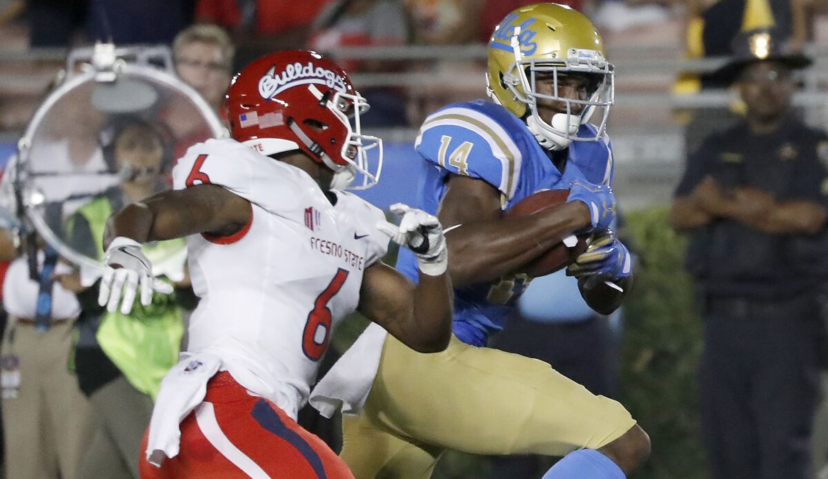 UCLA wide receiver Theo Howard breaks away for a touchdown against Fresno State during a game in 2017.