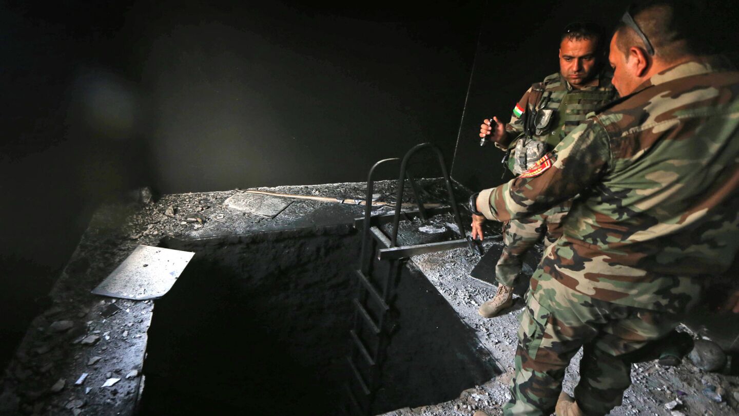 Iraqi soldiers inspect a tunnel in a building in the recaptured village of Shaquoli, about 35 kilometers east of Mosul, on Oct. 18, 2016.