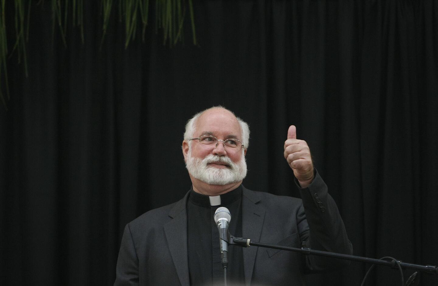 Father Greg Boyle, giving the thumbs up, was the keynote speaker at the annual YMCA of the Foothills Community Prayer Breakfast in La Canada Flintridge on Thursday, Nov. 7, 2013. Father Boyle is the founder of Homeboy Industries.